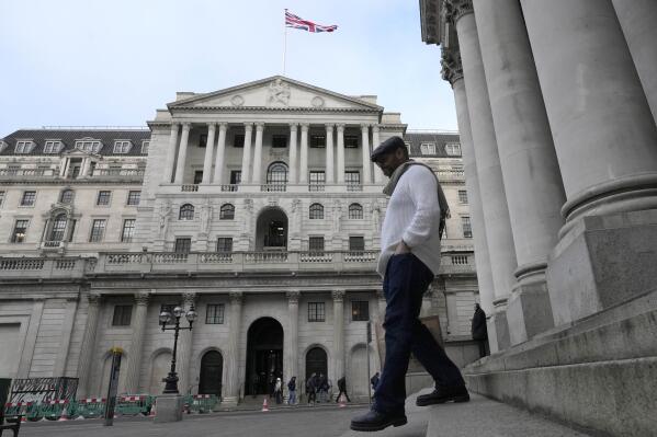 A man walks down steps in front of the Bank of England in London, Thursday, Feb. 2, 2023. The Bank of England is expected to raise interest rates by as much as half a percentage point. That would outpace the latest hike by the U.S. Federal Reserve. The move on Thursday comes as the central bank seeks to tame decades-high inflation that has driven a cost-of-living crisis and predictions of recession. (AP Photo/Frank Augstein)