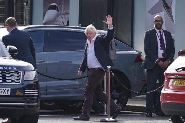 FILE - Former Prime Minister Boris Johnson arrives at Gatwick Airport in London, after travelling on a flight from the Caribbean, following the resignation of Liz Truss as Prime Minister, Oct. 22, 2022. Boris Johnson said Sunday Oct. 23, 2022 he will not run to lead UK Conservative Party, quashing comeback speculation. (Gareth Fuller/PA via AP, File)