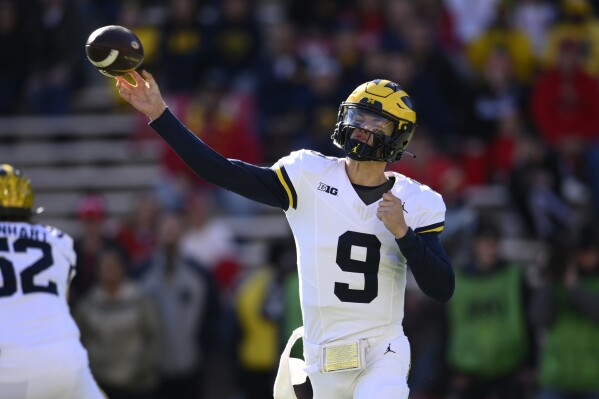 Michigan quarterback J.J. McCarthy (9) passes during the first half of an NCAA college football game against Maryland, Saturday, Nov. 18, 2023, in College Park, Md. (AP Photo/Nick Wass)