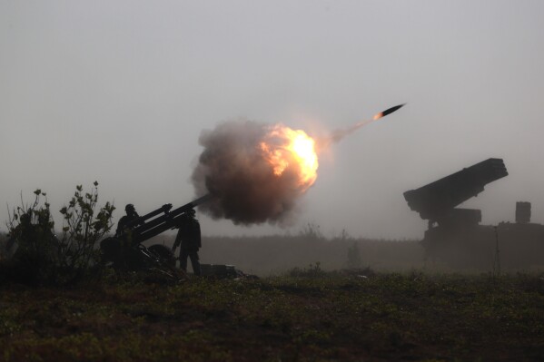 Indonesian Marines fire an artillery round during an amphibious landing operation at the Super Garuda Shield multi-national military exercise in Situbondo, East Java, Indonesia, Sunday, Sept. 10, 2023. Thousands of military personnel from the United States, Indonesia and other allied forces showcased their armor capabilities on Sunday in combat drills on the Indonesian island of Java as China takes more aggressive actions in the region. (AP Photo/Trisnadi)