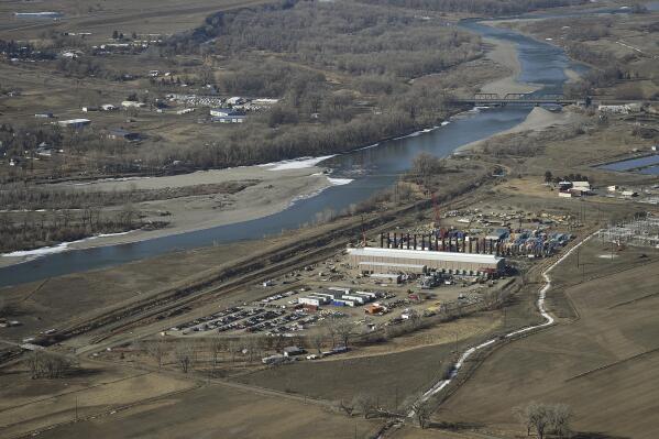 The Northwestern Energy's Laurel Generating Station, a natural gas-fired power plant, seen under construction near Laurel, Mont., on April 4, 2016. A Montana judge has cancelled the air quality permit for a natural gas power plant that's under construction along the Yellowstone River. State District Judge Michael Moses cited concerns over climate change in his Thursday, April 6, 2023, order. The $250 million plant in Laurel proposed by NorthWestern Energy would burn natural gas to produce up to 175 megawatts of electricity. State officials say they have no regulatory authority over greenhouse gas emissions. (Larry Mayer/The Billings Gazette via AP)