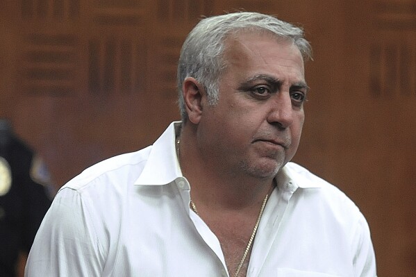 FILE - Developer Fred Daibes, center, appears at the hearing, Thursday, Sept. 17, 2015, for the home robbery defendants that attacked him in his Edgewater, NJ high-rise apartment, in Bergen Superior Court in Hackensack, N.J. Daibes is named as a co-defendant on a bribery indictment against U.S. Sen. Bob Menendez of New Jersey. (Mitsu Yasukawa /The Record of Bergen County via AP, File)