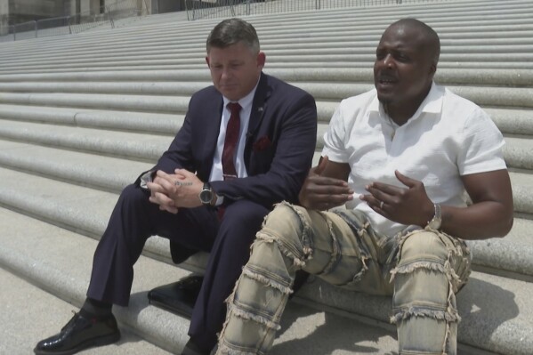 From left Bobby Gumpright and Jermaine Hudson talks with the Associated Press on Tuesday, April 29 in Baton Rouge, La. (AP Photo/Stephen Smith)