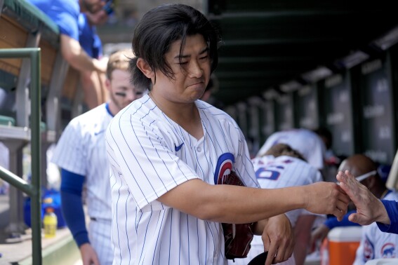 Chicago Cubs pitcher Shota Imanaga heads to the tunnel after pitching in the fifth inning of a baseball game against the Pittsburgh Pirates, Saturday, May 18, 2024, in Chicago. (AP Photo/Charles Rex Arbogast)