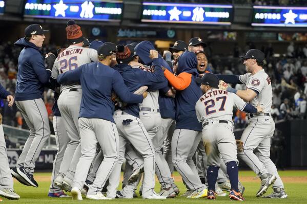 The Houston Astros celebrate after defeating the New York Yankees 6-5 to win Game 4 and the American League Championship baseball series, Monday, Oct. 24, 2022, in New York. (AP Photo/John Minchillo)
