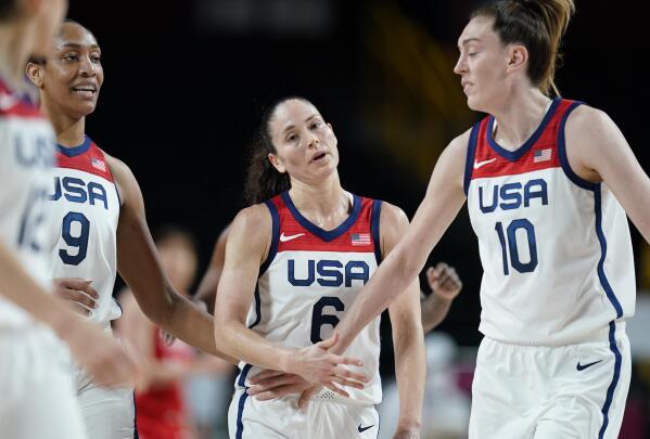 United States' Sue Bird (6), center, celebrates with teammates after making a shot during women's basketball preliminary round game against Japan at the 2020 Summer Olympics, Friday, July 30, 2021, in Saitama, Japan. (AP Photo/Charlie Neibergall)