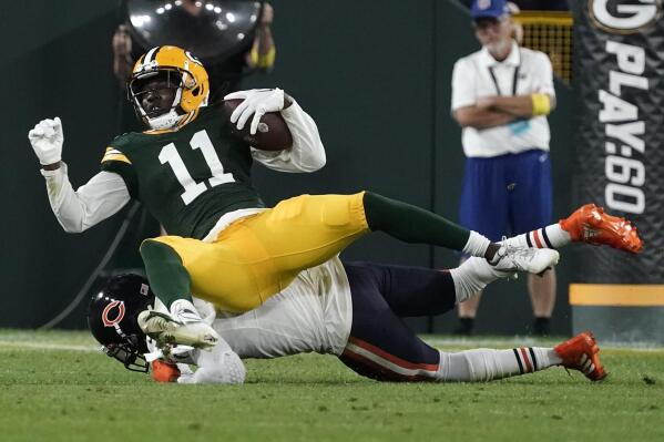 Green Bay Packers wide receiver Sammy Watkins (11) is tackled after catching a pass during the first half of an NFL football game against the Chicago Bears Sunday, Sept. 18, 2022, in Green Bay, Wis. (AP Photo/Morry Gash)