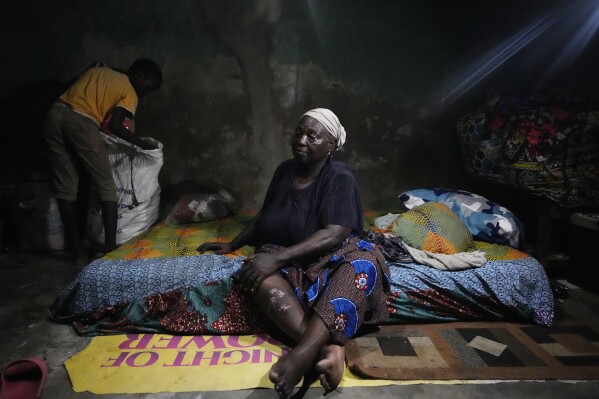 Funmilayo Kotun, 66-years-old, a malaria patient is photographed in her one room in Makoko neighbourhood of Lagos, Nigeria, Saturday, April 20, 2024. (AP Photo/Sunday Alamba)