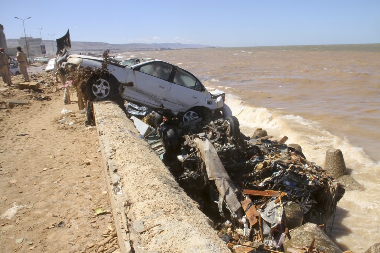 Damage from massive flooding is seen in Derna, Libya, Wednesday, Sept.13, 2023. Search teams are combing streets, wrecked buildings, and even the sea to look for bodies in Derna, where the collapse of two dams unleashed a massive flash flood that killed thousands of people. (AP Photo/Yousef Murad)