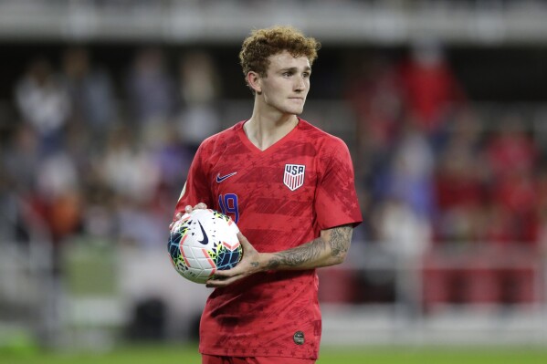 FILE - United States' Josh Sargent holds a ball during the second half of a CONCACAF Nations League soccer game against Cuba on Oct. 11, 2019, in Washington. Forward Sargent and midfielder Luca de La Torre will miss the United States' Nations League games because of injuries and were replaced on the roster Sunday, March 17, 2024, by winger Brenden Aaronson and forward Haji Wright. (AP Photo/Julio Cortez, File)