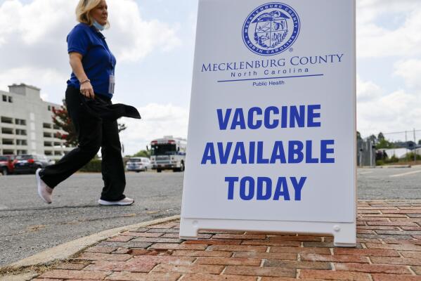 A Mecklenburg County Public Health employee arrives at a monkeypox vaccine clinic in Charlotte, N.C., Saturday, Aug. 20, 2022. (AP Photo/Nell Redmond)