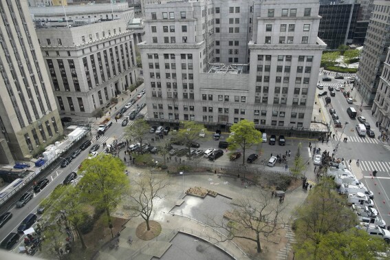 White fire extinguisher residue marks the spot in Collect Pond Park where a man lit himself on fire outside Manhattan criminal court, Friday, April 19, 2024, in New York. Emergency crews rushed away a person on a stretcher after fire was extinguished outside the Manhattan courthouse where jury selection was taking place in former President Donald Trump's hush money criminal case. (AP Photo/Mary Altaffer)