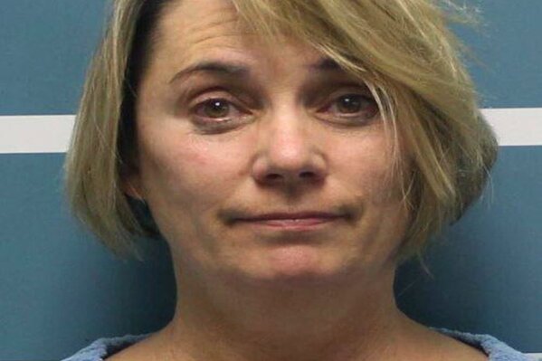
              This Wednesday, Dec. 5, 2018, photo released by Tulare County Sheriff's Office shows Margaret Gieszinger, a high school teacher in central California who was arrested on suspicion of felony child endangerment,after forcibly cutting the hair of one of her students while singing the National Anthem, authorities said. Gieszinger was arrested Wednesday, after videos posted to social media showed a student at University Preparatory High School in the city Visalia sitting in a chair at the front of the classroom as Gieszinger cuts his hair. Gieszinger is being held on $100,000 bail. It was not immediately known if she has an attorney. (Tulare County Sheriff's Office via AP)
            