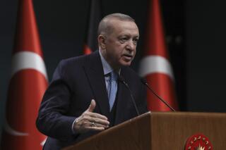 FILE - Turkey's President Recep Tayyip Erdogan speaks during a news conference, in Ankara, Turkey on May 14, 2022. Within a two-week span, Turkey's president has caused a stir by throwing a wrench in Sweden and Finland's historic bid to join the NATO alliance, lashed out at NATO-ally Greece and announced plans for a new incursion into Syria. The Turkish leader appears to be using Turkey's power to veto NATO's expansion as an opportunity to air a variety of grievances against the Western nations and to force them to take action against Kurdish militants and other groups that Turkey views as terrorists.( AP Photo/Burhan Ozbilici, File)