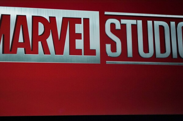 FILE - A Marvel Studios logo is shown during the Walt Disney Studios presentation at CinemaCon 2023, the official convention of the National Association of Theatre Owners (NATO) at Caesars Palace, Wednesday, April 26, 2023, in Las Vegas. A crewmember who was working on the Marvel Studios series “Wonder Man” has died following an accident on set. The trade publication Deadline reports that the man was a rigger who fell from the rafters Tuesday morning, Feb. 6, 2024, at CBS Radford Studios in Studio City, Calif. (AP Photo/Chris Pizzello, File)