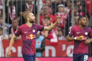 Leipzig's Konrad Laimer celebrates after scoring his side's opening goal during the German Bundesliga soccer match between FC Bayern Munich and RB Leipzig at the Allianz Arena stadium in Munich, Germany, Saturday, May 20, 2023. (AP Photo/Matthias Schrader)