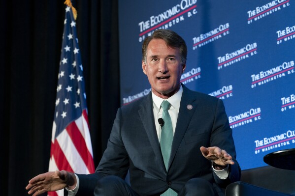 Gov. Glenn Youngkin, R-Va., speaks to David Rubenstein during an interview hosted by the Economic Club of Washington, Tuesday, Sept. 26, 2023, in Washington. (AP Photo/Stephanie Scarbrough)