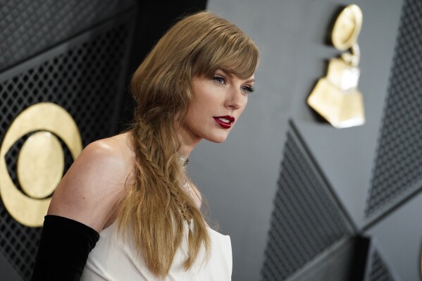 Taylor Swift arrives at the 66th annual Grammy Awards on Sunday, Feb. 4, 2024, in Los Angeles. (Photo by Jordan Strauss/Invision/AP)