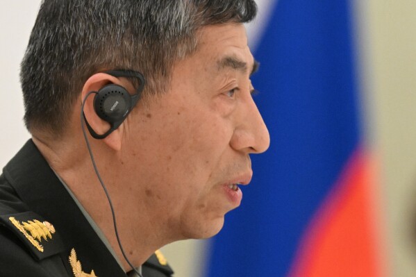 FILE - China's Defense Minister Gen. Li Shangfu speaks to Russian President Vladimir Putin and Russian Defense Minister Sergei Shoigu during their meeting at the Kremlin in Moscow, Russia, on April 16, 2023. Defense Minister Li departed Monday, Aug. 14, 2023, for Russia and Belarus in a show of support for those nations which the West has sought to isolate over Russia's invasion of Ukraine. (Pavel Bednyakov, Sputnik, Kremlin Pool Photo via AP, File)