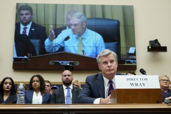 FILE - FBI Director Christopher Wray listens as Rep. Jim Jordan, R-Ohio, chair of the House Committee on the Judiciary, speaks during an oversight hearing, Wednesday, July 12, 2023, on Capitol Hill in Washington. Wray appeared before the House Judiciary Committee for the first time since Republicans took control in January. (AP Photo/Patrick Semansky, File)