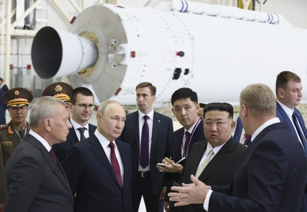 FILE - Russian President Vladimir Putin, second left in front, and North Korea's leader Kim Jong Un, second right in front, examine a rocket assembly hangar during their meeting at the Vostochny cosmodrome outside the city of Tsiolkovsky, about 200 kilometers (125 miles) from the city of Blagoveshchensk in the far eastern Amur region, Russia on Sept. 13, 2023. North Korea has likely supplied several types of missiles to Russia to support its war in Ukraine, along with its widely reported shipments of ammunition and shells, South Korea’s military said Thursday, Nov. 2, 2023. Russian Federal Space Corporation Roscosmos CEO Yuri Borisov is on the left. (Artyom Geodakyan, Sputnik, Kremlin Pool Photo via AP, File)