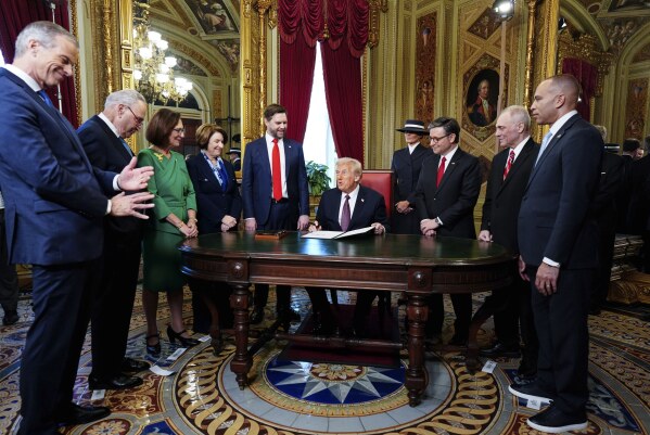 ImagePresident Donald Trump, center, takes part in a signing ceremony in the President’s Room after the 60th Presidential Inauguration, Monday, Jan. 20, 2025, at the U.S. Capitol in Washington. (Melina Mara/The Washington Post via AP, Pool)