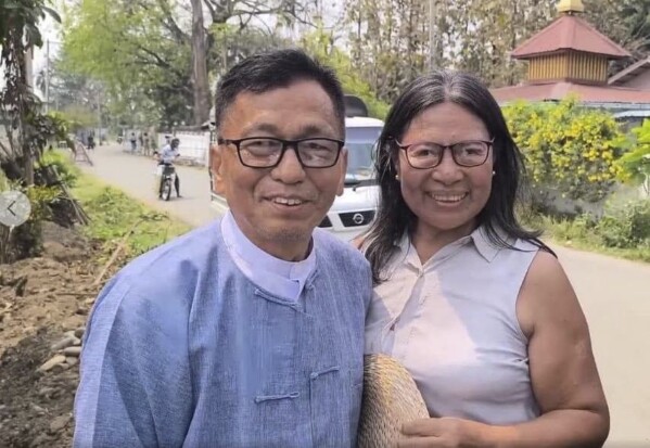 Hkalam Samson poses for photography together with his wife after his release from the prison in Myintkyina township in Kachin state, Myanmar on Wednesday, April 17, 2024. Hkalam Samson, prominent Christian church leader and human rights advocate from Myanmar’s Kachin ethnic minority, was detained by the authorities just hours after he was released from prison under an amnesty by the military government, a relative, a colleague and local media said Thursday, April 18, 2024.(AP Photo)