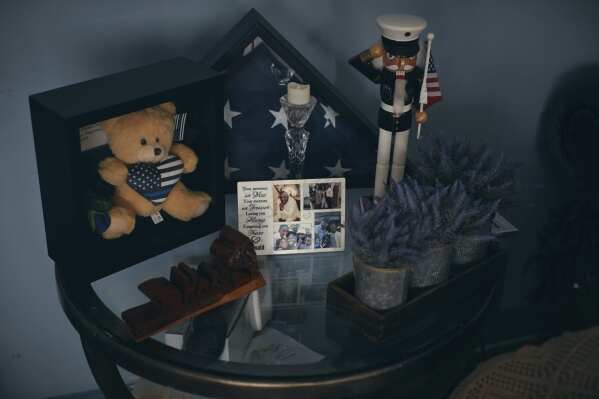 A memorial Sharline Volcy set up in honor of her husband, Ronald Donat, is seen Monday, Feb. 3, 2025, at her home in Orange, N.J. (AP Photo/Andres Kudacki)