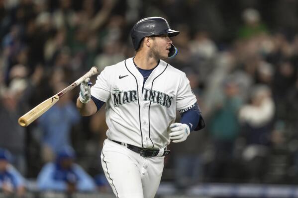 Seattle Mariners' Ty France flips his bat after hitting a three-run home run that scored Julio Rodriguez and Jesse Winker off of Kansas City Royals relief pitcher Dylan Coleman during the eighth inning of a baseball game, Saturday, April 23, 2022, in Seattle. The Mariners won 13-7. (AP Photo/Stephen Brashear)