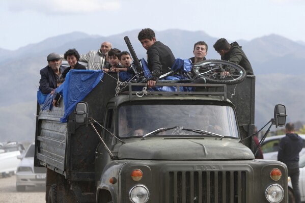 FILE - Ethnic Armenians from Nagorno-Karabakh travel on a truck on their way to Kornidzor, Armenia, on Sept. 26, 2023. Israel has quietly helped fuel Azerbaijan’s campaign to recapture Nagorno-Karabakh, officials and experts say, supplying powerful weapons to Azerbaijan ahead of its lightening offensive last month that brought the Armenian enclave in its territory back under its control.(Stepan Poghosyan, Photolure photo via AP, File)