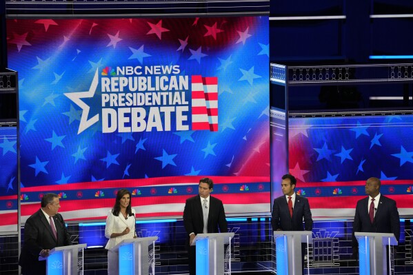 Republican presidential candidates from left, former New Jersey Gov. Chris Christie, former UN Ambassador Nikki Haley, Florida Gov. Ron DeSantis, businessman Vivek Ramaswamy and Sen. Tim Scott, R-S.C., listen during a Republican presidential primary debate hosted by NBC News Wednesday, Nov. 8, 2023, at the Adrienne Arsht Center for the Performing Arts of Miami-Dade County in Miami. (AP Photo/Rebecca Blackwell)