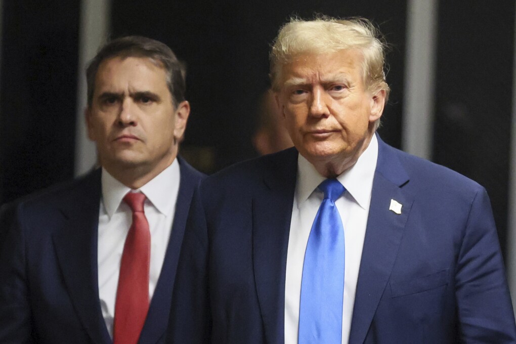 Republican presidential candidate and former U.S. President Donald Trump walks next to his attorney Todd Blanche, at Manhattan state court in New York, Monday, April 22, 2024. (Brendan McDermid/Pool Photo via AP)