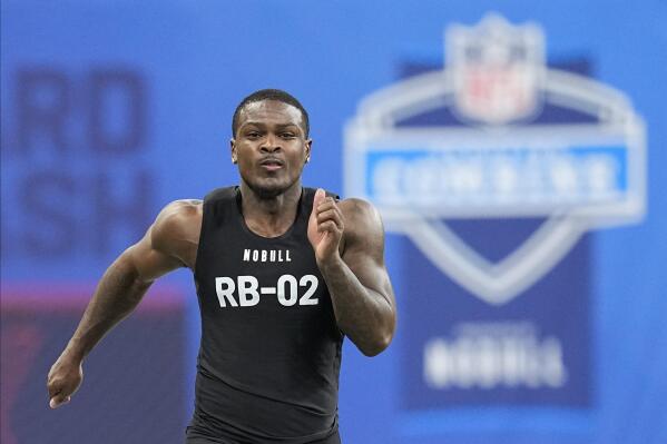 Texas A&M running back Devon Achane runs the 40-yard dash at the NFL football scouting combine in Indianapolis, Sunday, March 5, 2023. (AP Photo/Darron Cummings)