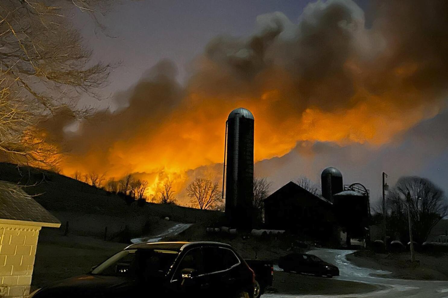 The East Palestine sky, illuminated by the February train derailment