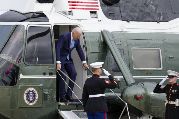 President Joe Biden steps off Marine One before he boards Air Force One at Andrews Air Force Base, Md., Tuesday, Jan. 30, 2024, en route to Florida. (AP Photo/Jess Rapfogel)