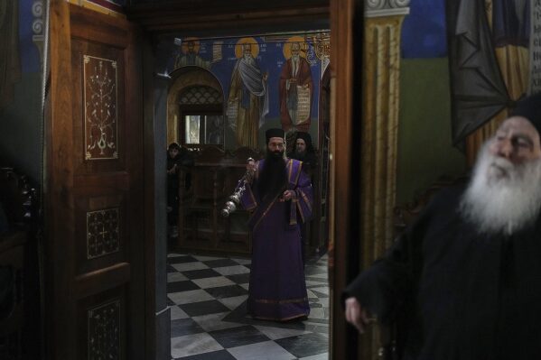 A monk spreads incense during afternoon prayers at the Simonopetra, or Simonos Petra Monastery, home of the all-male autonomous community Agion Oros, or Holy Mountain, on the peninsula of Mount Athos in northern Greece, April 14, 2025. (AP Photo/Thanassis Stavrakis)