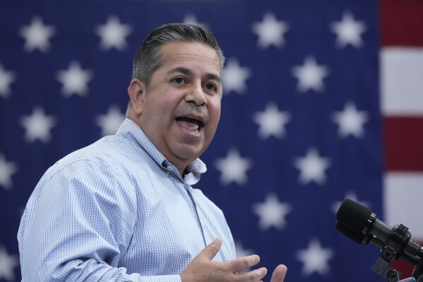 FILE - Sen. Ben Ray Lujan, D-N.M., speaks at Arcosa Wind Towers, Aug. 9, 2023, in Belen, N.M. Lujan, Sen. Bob Menendez, D-N.J., and Sen. Alex Padilla, D-Calif., join the congressional caucus Hispanics in Congress at a press conference in front of the Capitol building where they attacked both Senate Republicans for demanding a change in border policy in exchange for passing aid to Ukraine as well as Biden for making concessions that they warned would harm asylum.  seeking immigrants and ultimately undermining the United States' standing as a welcoming nation for immigrants.  (AP Photo/Alex Brandon)