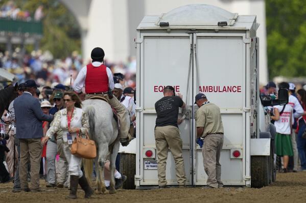 Here Mi Song is taken to the equine ambulance after the10th horse race at Churchill Downs Saturday, May 6, 2023, in Louisville, Ky. (AP Photo/Julio Cortez)
