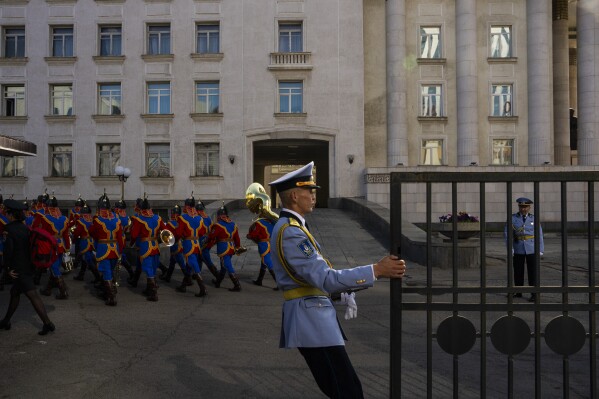 The Mongolian State Honor Guard enters the Saaral Ordon Government Building in Sukhbaatar Square after the welcoming ceremony with Mongolian President Ukhnaagiin Khurelsukh and Pope Francis on the square in Ulaanbaatar, Mongolia, on Sept. 2, 2023. (AP Photo/Louise Delmotte)
