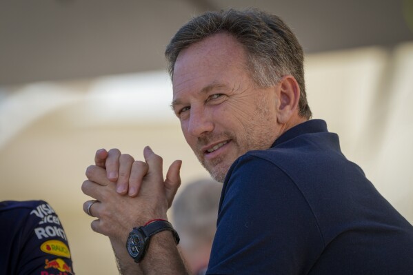 Red Bull team principal Christian Horner sits in the paddock during Formula One pre season testings at the Bahrain International Circuit in Sakhir, Bahrain, Wednesday, Feb. 21, 2024. (AP Photo/Darko Bandic)