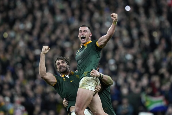 South Africa's Jesse Kriel, right, and South Africa's Eben Etzebeth celebrate after the Rugby World Cup final match between New Zealand and South Africa at the Stade de France in Saint-Denis, near Paris , Oct. 28, 2023. (AP Photo/Thibault Camus)