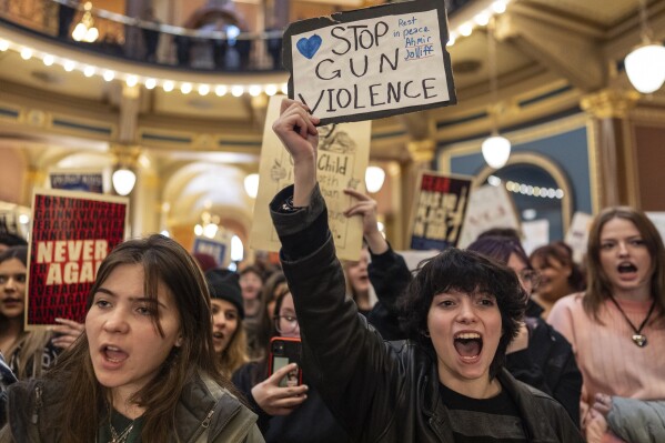 Students and supporters gather in the rotunda to protest gun violence during the opening day of the Iowa Legislature, Monday, Jan. 8, 2024, at the Capitol in Des Moines, Iowa. The school walkout and protest were organized by March For Our Lives Iowa in reaction to a school shooting in Perry, Iowa, in which a 17-year-old killed a sixth-grade student and wounded seven other people before authorities say he died of a self-inflicted gunshot wound. (AP Photo/Carolyn Kaster)
