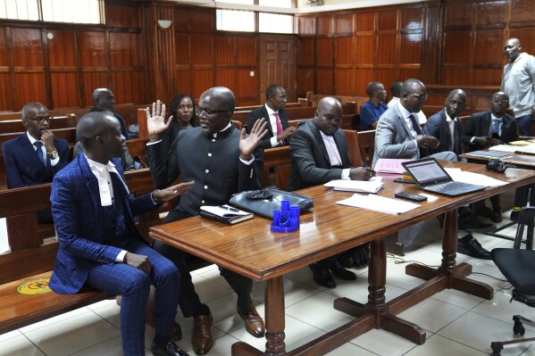 Lawyers react as Justice Chacha Mwita delivers judgement on a petition against the deployment of Kenyan forces to Haiti, at Milimani court in the capital Nairobi, Kenya, Friday, Jan. 26, 2024. A Kenyan court on Friday blocked the deployment of 1,000 police officers to Haiti, to help the Caribbean nation deal with gang violence. 