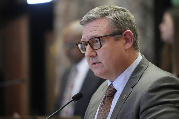 Mississippi State Senate Education Committee Chairman Sen. Dennis DeBar, R-Leakesville, presents a bill before legislators on the floor of the Senate chamber, Wednesday, April 3, 2024, at the Mississippi Capitol in Jackson, Miss. (AP Photo/Rogelio V. Solis)