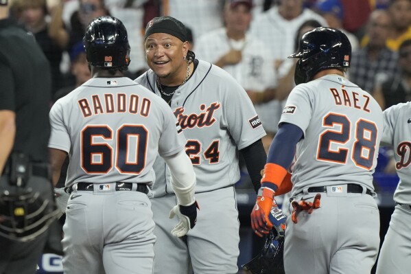 Detroit Tigers' Miguel Cabrera (24) and Javier Baez (28) congratulate Akil Baddoo (60) after Baddoo hit a three-run home run during the second inning of a baseball game against the Miami Marlins, Saturday, July 29, 2023, in Miami. (AP Photo/Marta Lavandier)