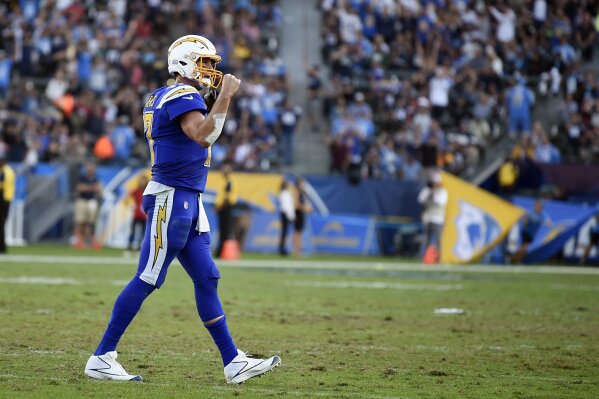 
              Los Angeles Chargers quarterback Philip Rivers pumps his fist after his team scored during the second half of an NFL football game against the Arizona Cardinals Sunday, Nov. 25, 2018, in Carson, Calif. (AP Photo/Kelvin Kuo)
            