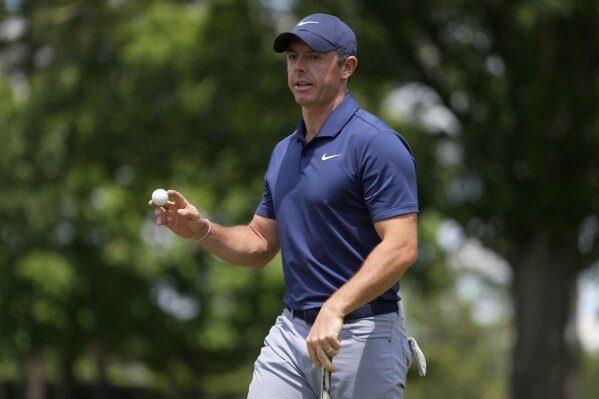 Rory McIlroy, of Northern Ireland, waves after making a putt on the fifth hole during the third round of the Wells Fargo Championship golf tournament at the Quail Hollow Club Saturday, May 11, 2024, in Charlotte, N.C. (AP Photo/Chris Carlson)