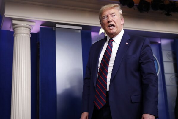 President Donald Trump leaves after speaking about the coronavirus in the James Brady Press Briefing Room, Friday, March 27, 2020, in Washington. (AP Photo/Alex Brandon)