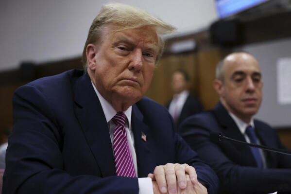 Former President Donald Trump appears at Manhattan criminal court in New York, Friday, April 19, 2024. (Spencer Platt/Pool Photo via AP)