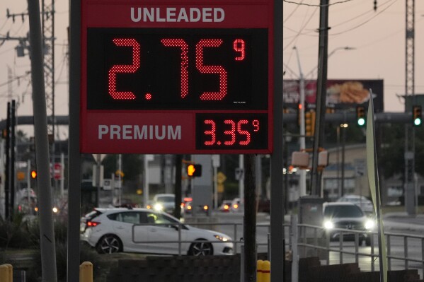 Motorist pass posted gas prices, Monday, June 10, 2024, in San Antonio. Gas prices are once again on the decline across the U.S., bringing some relief to drivers now paying a little less to fill up their tanks. (AP Photo/Eric Gay)